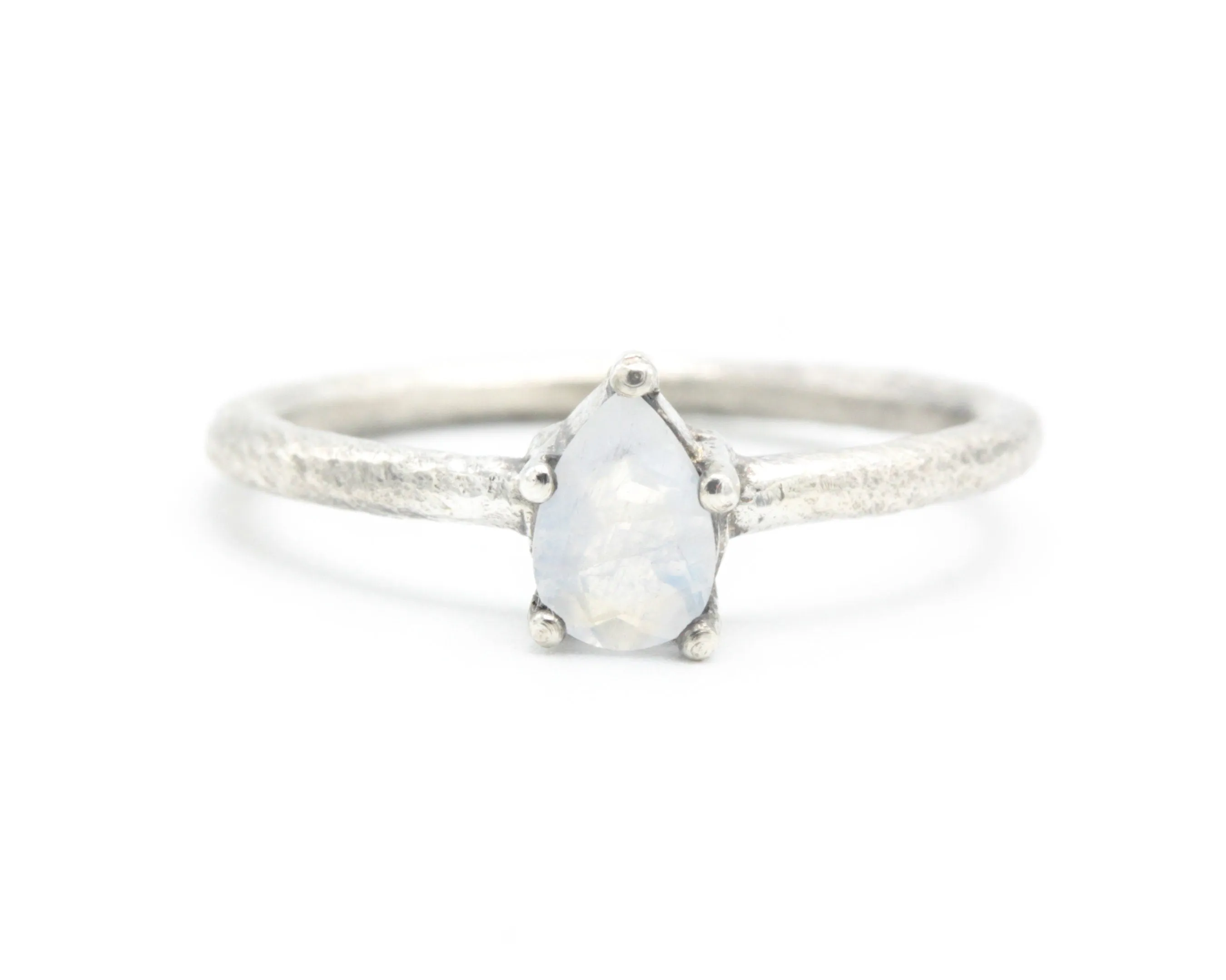 Teardrop faceted Moonstone ring in prongs setting with sterling silver oxidized texture band