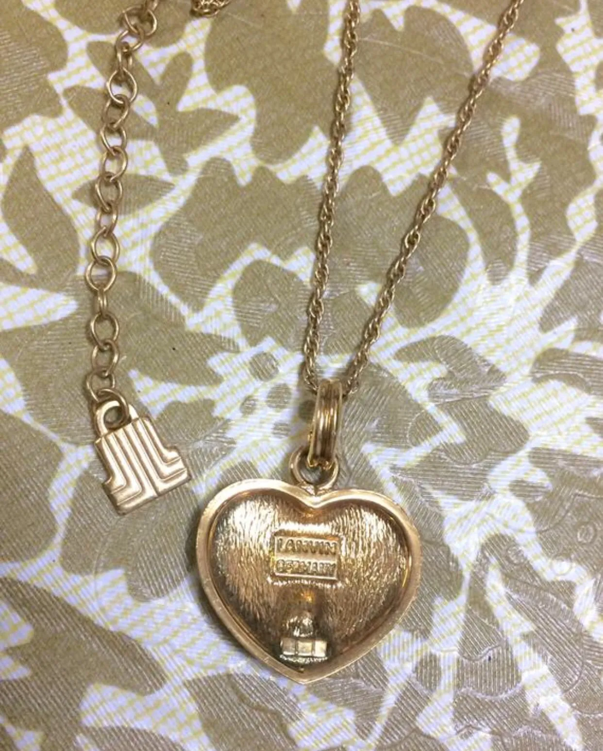 Vintage LANVIN golden skinny chain necklace with heart logo charm pendant top with clear crystals and blue crystal. 05063010