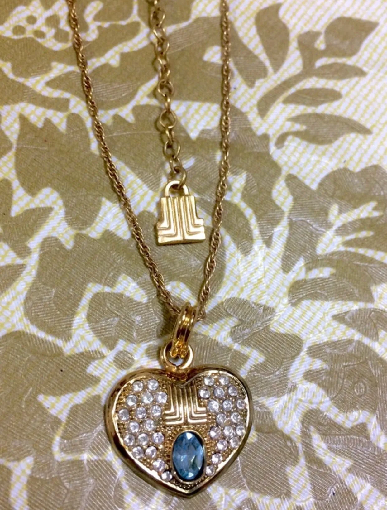 Vintage LANVIN golden skinny chain necklace with heart logo charm pendant top with clear crystals and blue crystal. 05063010
